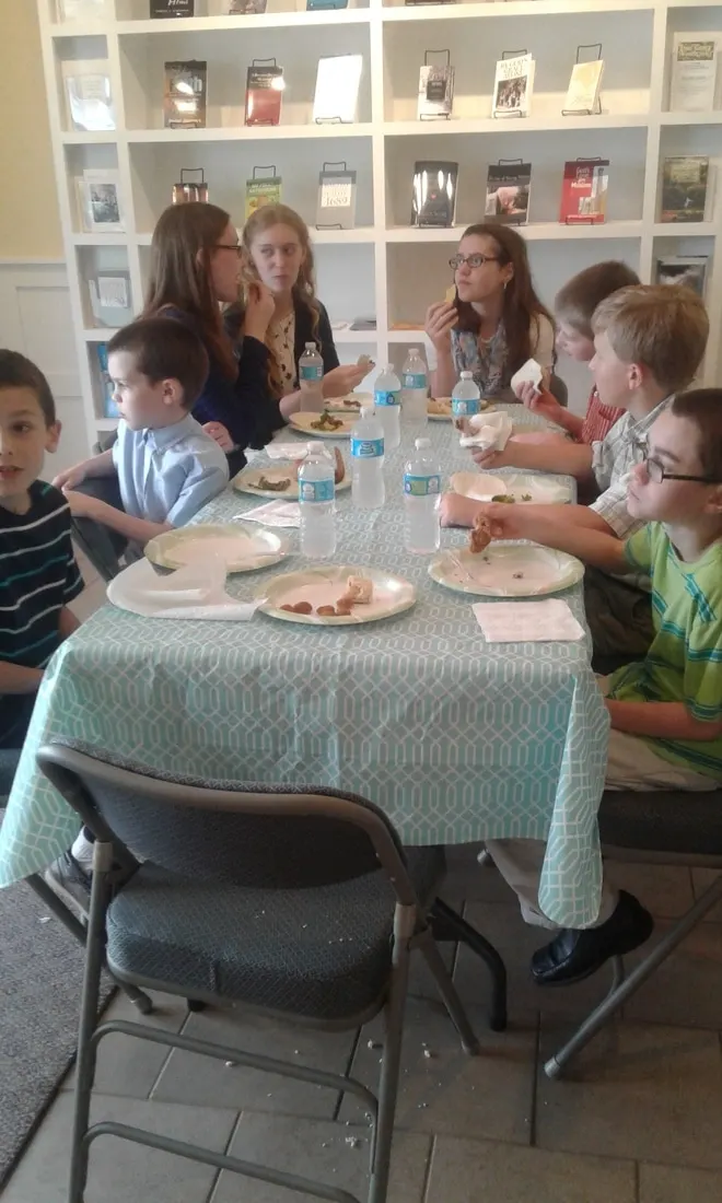 Church families sharing a fellowship meal