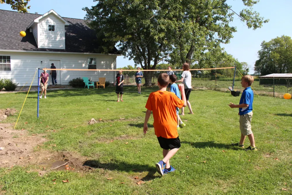 Children playing outdoors at a church celebration